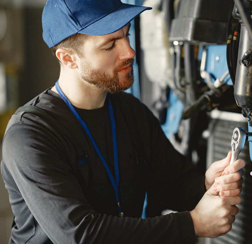 truck mechanic man in blue hat